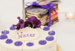 Each table offered a word of empowerment on a dessert cake, and each attendee received a journal to make notes. BY DENY HOWETH