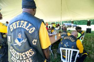 Attendees gather under the tent to hear stories and performances.