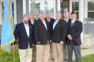The Sons of American Legion officers with the SAL flag are shown standing in back (l-r) Kevin Hammill, judge advocate; Bob Cunningham, adjutant; and Jim Hammill, Sgt. at Arms. In front are Everett Wodiska, Sgt. at Arms; Steve Carey, Commander; Jay Allen, finance officer; and Ron Webster, 2nd vice commander. Not shown are Bill Stranch, 1st vice commander; Pete Good, historian; and Father Chris Hanley, chaplain.