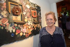 Last year’s The Mary Trimble Lynch Best is Show Award winner Felicia Belair-Rigdon stands with Center Piece/Memory:Collage, Assemblage  in her solo show The Art of Memory. STEVEN BILLUPS PHOTO Rehoboth Art League