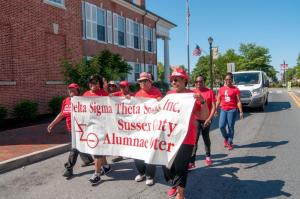 Delta Sigma Theta Sorority Alumnae of Sussex County parade through town to the Richard Allen School.