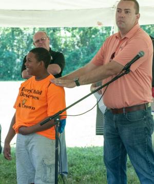 Sen. Brian Pettyjohn, R-Georgetown, points out the shirt Joey Finney Jr. is wearing to bring attention to youth being empowered.