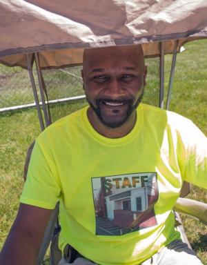 Ivan Neal, Assistant principal at Georgetown Elementary School and board member of the Richard Allen Coalition prepares for his turn at the entrance of the celebration.