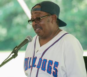 Harry Crapper, treasurer of the Richard Allen Coalition, talks to the crowd and sings a tune.
