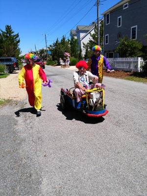 Clowns hand out balloon animals to children along the parade route. Shown are (l-r) Dick Dussman, Eckert Erb and John Carter.