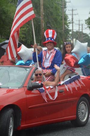 Uncle Sam Tony Zeccola rides atop a convertible. RON MACARTHUR PHOTO