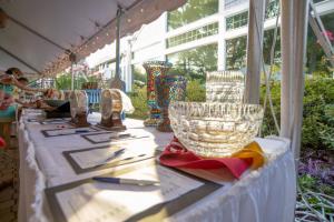 Silent auction items sparkle in the evening sun.