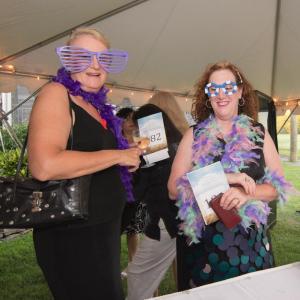 Joan Kloepfer, left, and Sharon Leiser prepare for the photo booth.