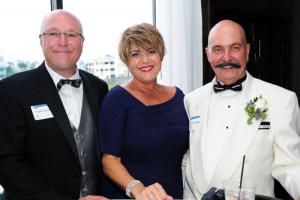 Frank and Amy Iacono, left, enjoy the cocktail reception with Tim McLaughlin. DAN COOK PHOTO