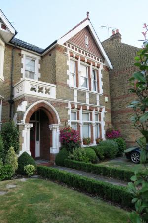 This side street London townhouse with its buttoned up gardens and flowers caught my eye. In the attic behind the gable window, maybe,  Harry Potter- and Peter Pan-like characters lay corked inside dusty bottles and lamps.