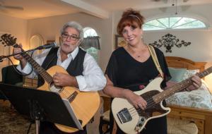 The Problematics, Mike, left and Lorraine Messitt, perform for the celebration.