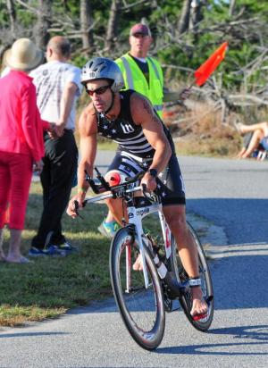 Patrick Beebe of Rehoboth Beach pulls into the finish of the bike leg and takes ninth place overall with a 01:16:08. DAN COOK PHOTO