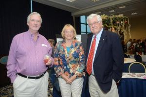 Enjoying the social atmosphere are (l-r) Rusty Hesse and Jay and John Hukill. All saints