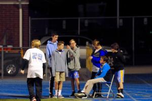 Beacon players start to surround Fredman’s field chair. DAVE FREDERICK PHOTO