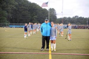 Grandpa Fredman and Katie Frederick share a magical pregame moment on the way to halftime of tears. ERIC GOOCH PHOTO