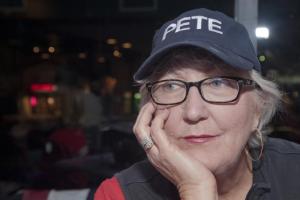 Legislative Assistant Nancy Hickman watches the polls during the celebration at Grotto Pizza in Rehoboth