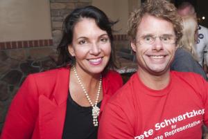 Kathy McGuiness and Andy Staton wearing red in support of Rep. Pete Schwartzkopf.