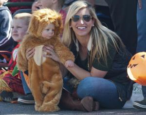 The Lion Owen Tucci keeps his eyes on the candy with mom Lindsey.