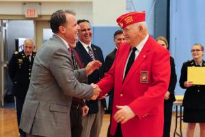 Retired Marine Everett Beach, right, is congratulated by Cape Superintendent Robert Fulton. DAN COOK PHOTO
