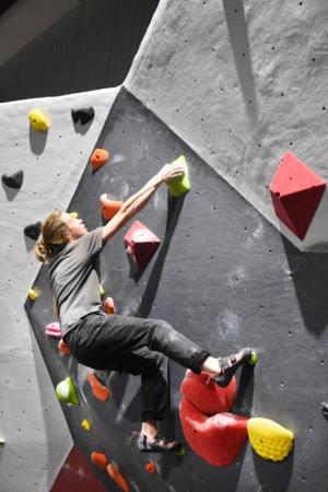 Flannery Shay-Nemirow nears the top of RISE’s bouldering wall. NICK ROTH PHOTO