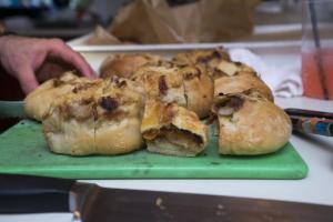 Dru Trevis’ potato volcano roll is sliced.