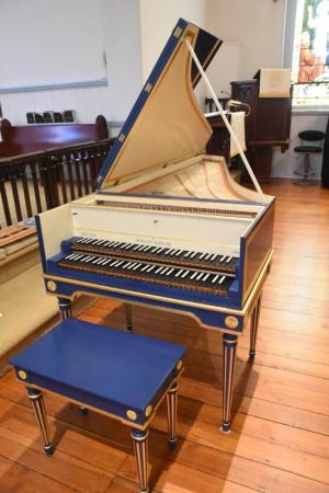 The French double harpsichord sits in front of the altar at St. Peter’s Church. NICK ROTH PHOTO