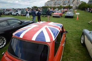 A view of the 22nd Annual British Motorcar Show from behind a Mini Cooper adorned with the Union Jack. British Car Show