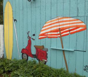 Dewey artist Leah Beach has spruced up the old produce stand with beach-themed artwork. CHRIS FLOOD PHOTO