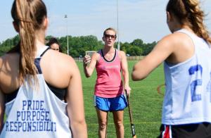 Camp co-founder and Olympian Kate Barber Kinnear explains a drill.
