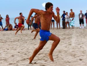 Alec Hochrein sprints for the Delaware State Parks Beach Patrol guards. They took second place to OCBP in a photo finish.