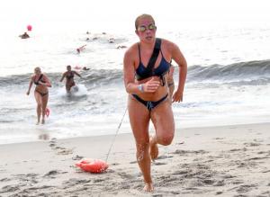 Dewey Beach Patrol Rookie of the Year Allison Thomas finishes up the buoy charge competition during the July 19 event.