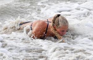 Cape grad Eddy Shoop splashes down in the line charge competition.