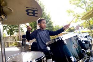 Andreé Mosley practices drums.