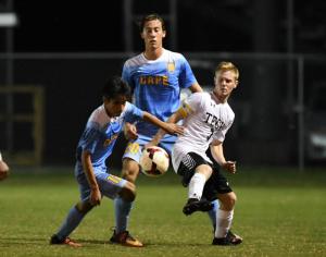 Cape’s Chris Gonzalez, left, and Tech’s Michael Barr battle for a 50/50 ball while defender Luke Mulcahy awaits the outcome.