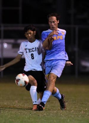 Cape defender Luke Mulcahy, right, kicks the ball away from Sussex Tech’s Byron Suarez-Garcia.