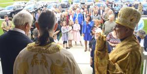 Congregants gather in front of the church for the blessing.