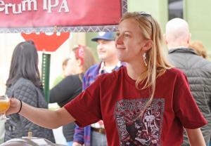 Kim Schoenberg gladly hands out a glass of Liquid Truth Serum IPA.