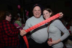 Bobby Schappert uses his charm to sell some raffle tickets to Sarah Young. Shrimp Fest