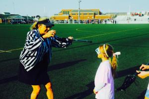 Lacrosse official Karla Andre checks the stick of an Atlantic Lacrosse player. DAVE FREDERICK PHOTO