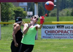 Kasey O’Brien, right, loses a little water after a near collision with Laurel Harrington in the outfield.