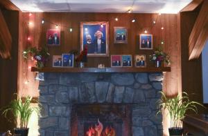 Board members and farmers are remembered in a display of portraits over the fireplace.
