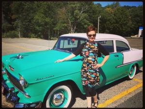 Mod Betty poses with her Retro Roadmap vintage car.