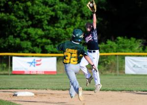 Milton shortstop Ryan Coulbourne gets some ups to stop a throw from going into center.