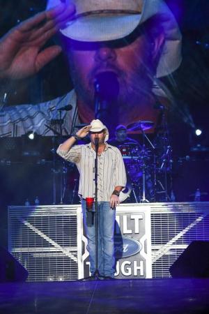 Toby Keith salutes all the veterans in attendance.