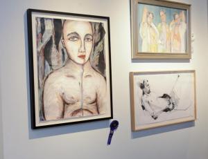 Mixed media painting by Rebecca Raubacher, Child’s Fire, left, won Outstanding work award; lower right is a Wayne Weeks sketch; top right is Best in Show winner Three Graces by Sydney McGinley.