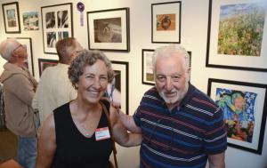 Photographers Marta Nammack, left, and Adam Terzian pose for a photo in the photography wing of the exhibit.