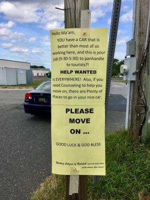 A group called Working Citizens of Rehoboth left this message for a homeless woman who often stands on the corner.