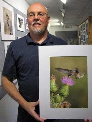 Earl Blansfield won multiple awards this year, including first place in native wildlife, and second place in native birds with "Hummer in the Thistle."