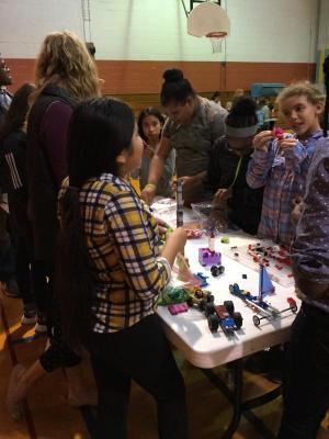 Attendees (l-r) Candy Sebastian Gonzalez, teacher Franci Minni, Madison Parish, paraprofessional Richard Miller, Kelsey Ramos, Timia Rossi, McKinzie Cartwright and Gabrielle Price built different models with Legos.