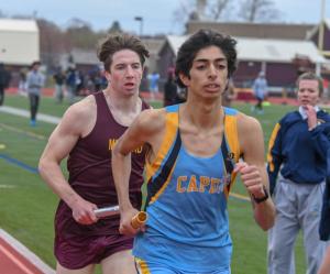 Daniel  Adili-Khams leads Ben Sobota of Milford on anchor of  4 by 800. Sobota would come back and win the race . ben is grandson of former cape teacher Alan Campo  DAVE FREDERICK PHOTO